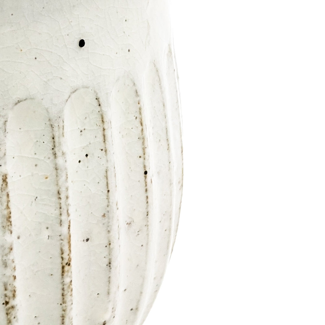 Zoomed in image on the kohiki powdery crackle glaze on the side of a mug